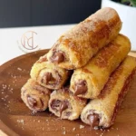 Deliciously rolled French toast filled with sweet cream and toasted to perfection.